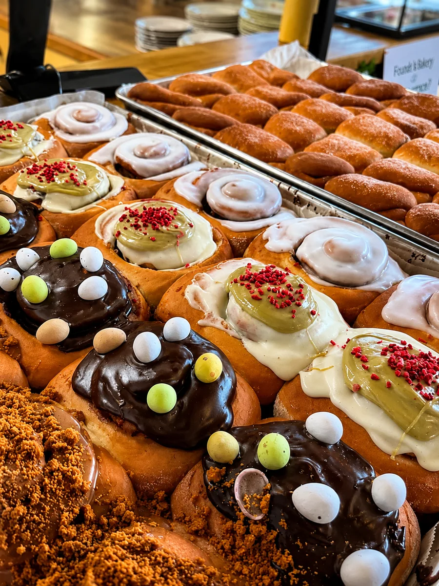 A colourful display of iced buns and pastries at Cafe in the Park